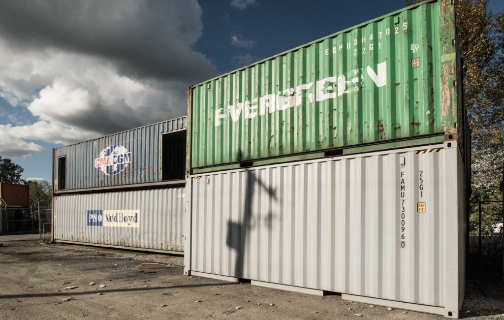 Shipping containers, storage containers, freight containers, and sea cans for sale stacked and ready for sale