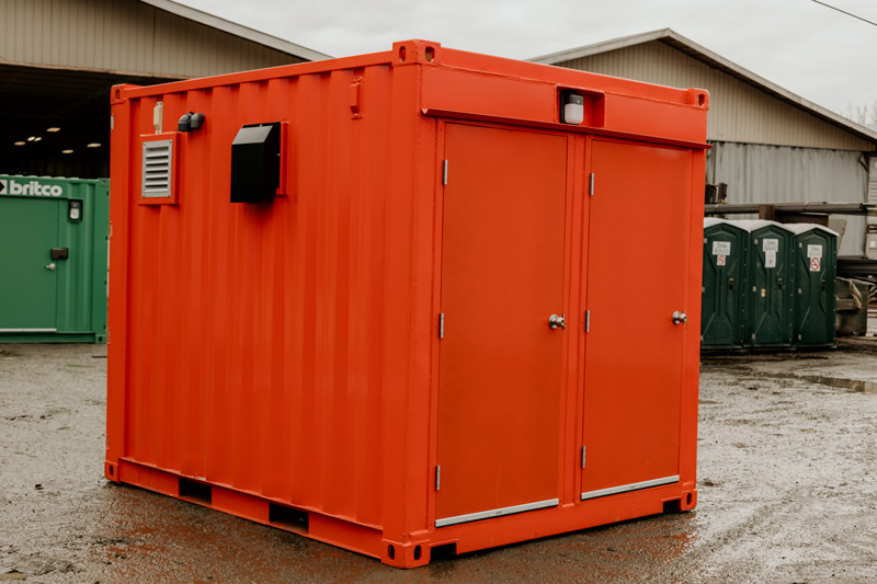 Compact and portable executive bathrooms made from a shipping container