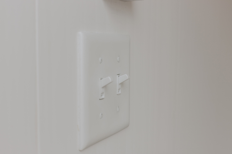Lighting and fan control switches for a portable executive bathroom