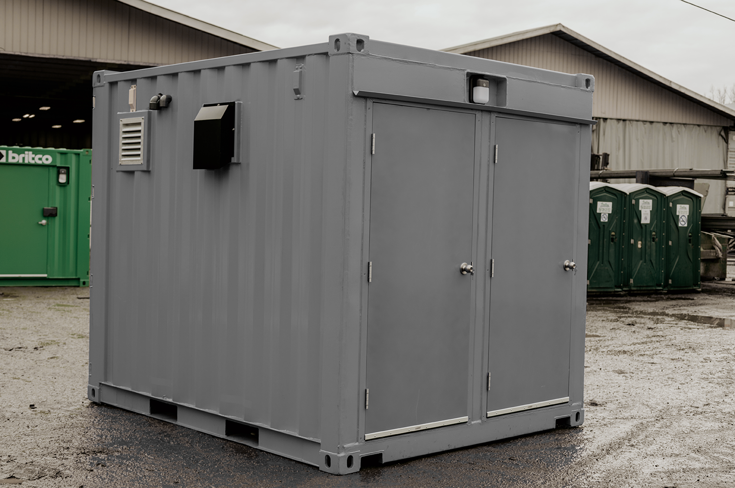 portable bathrooms with durable corrugated steel walls made from shipping containers